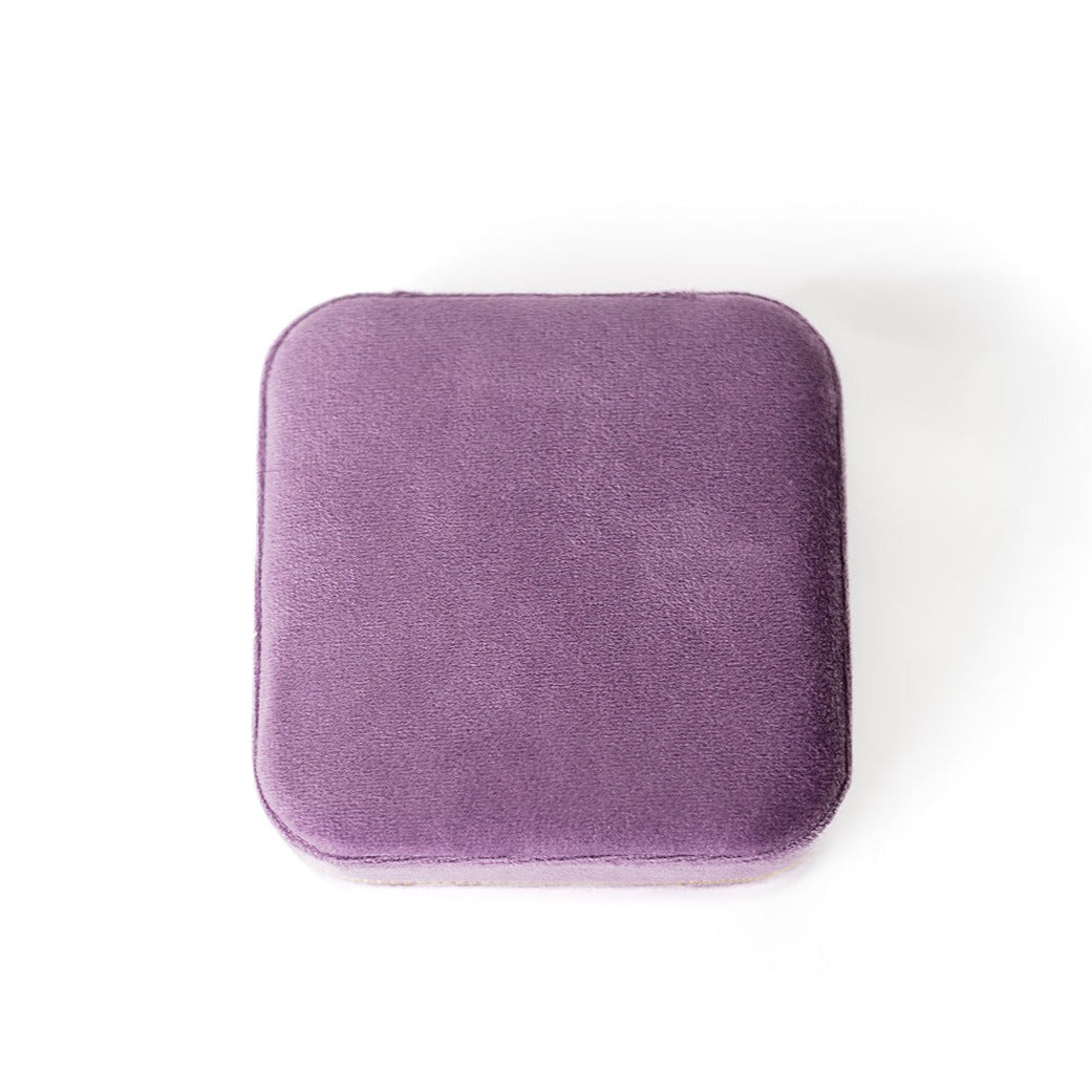The outside of a mauve jewelry case.