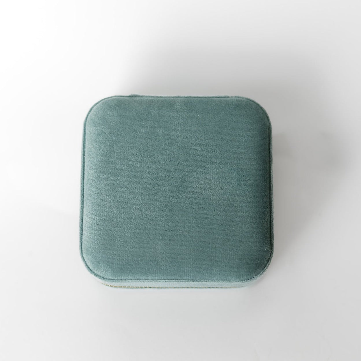 The outside of a sage jewelry case.