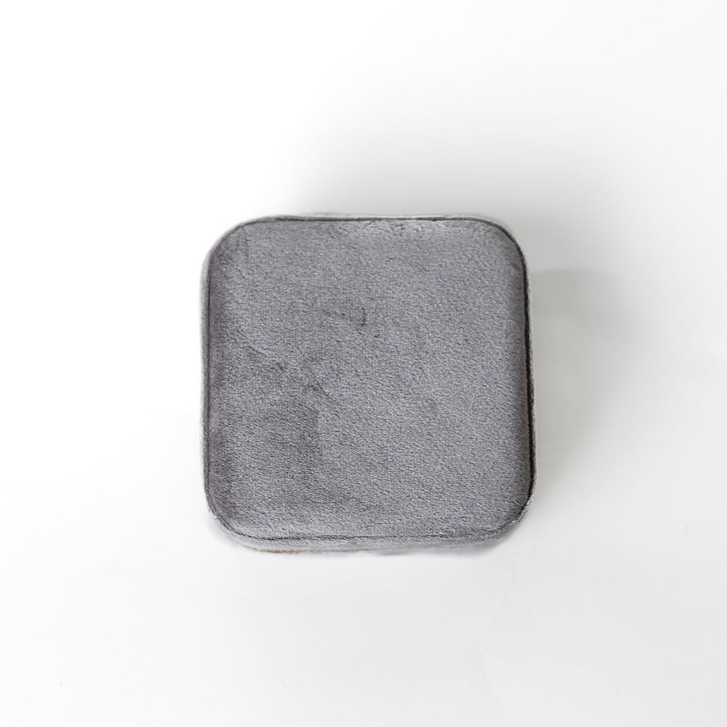 The outside of a silver jewelry case.
