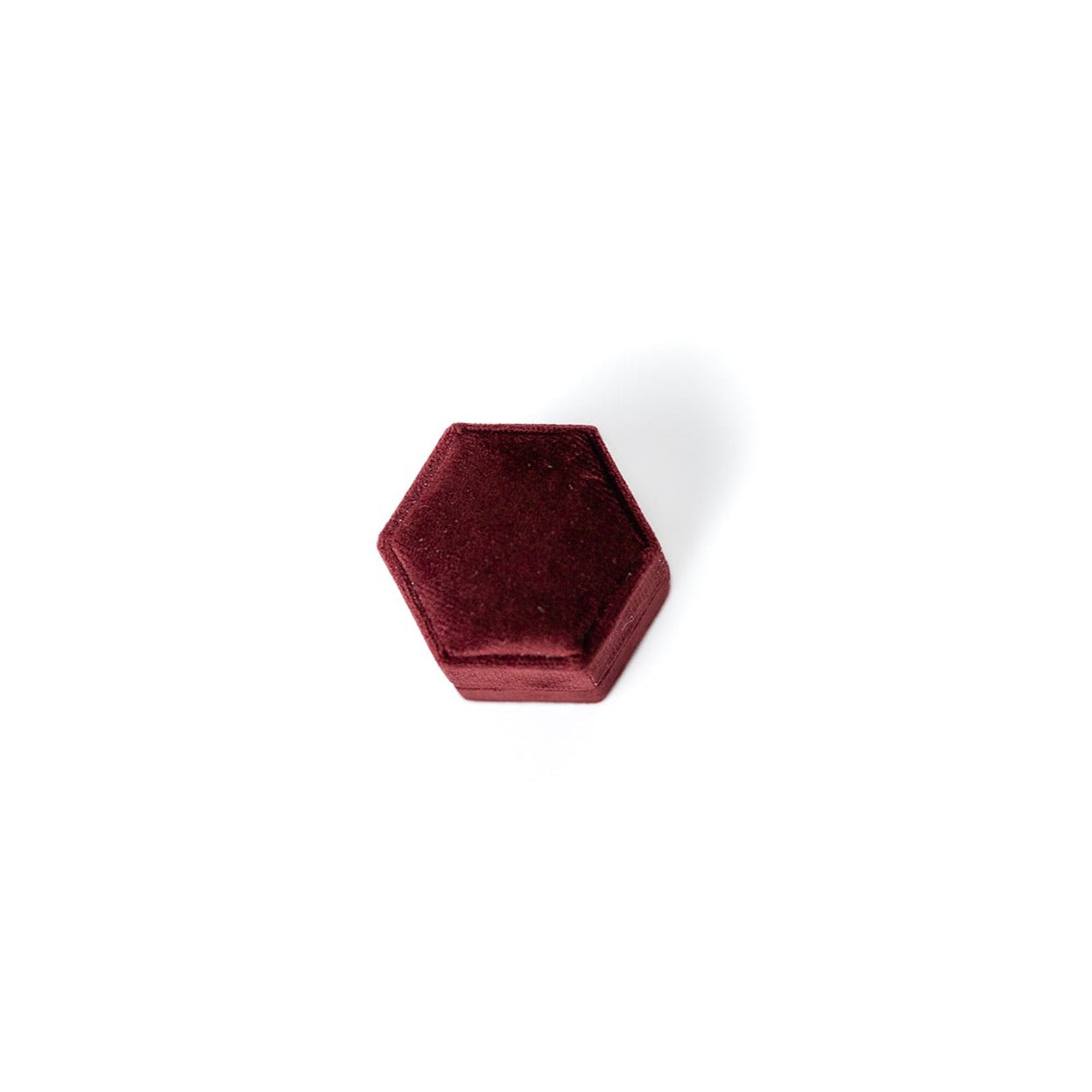 The outside of a merlot hexagon ring box.