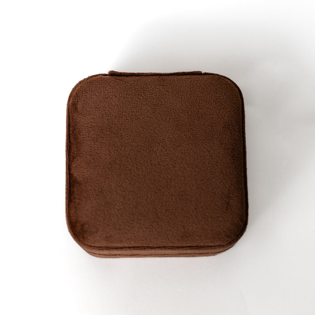 The outside of a chocolate-coloured jewelry case.