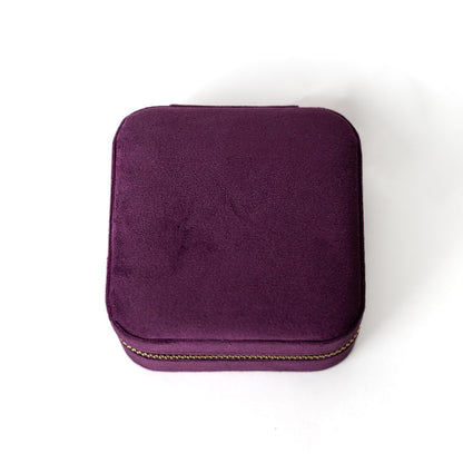 The outside of a plum-coloured jewelry case.