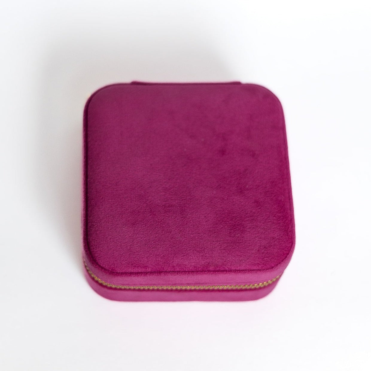 The outside of a fuchsia jewelry case.