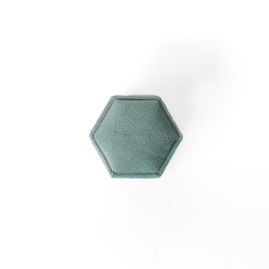 The outside of a sage hexagon ring box.