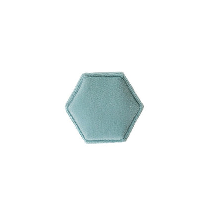 The outside of an aqua hexagon ring box.