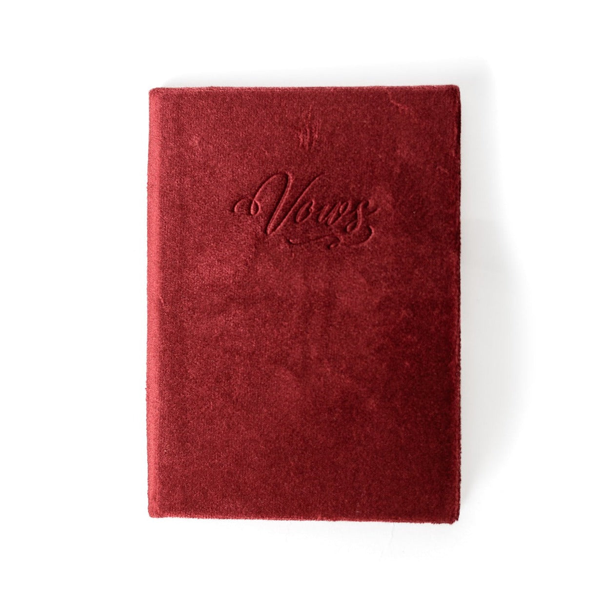 A red vow book with the word "Vows" embossed on the front cover.